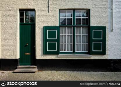 Door and window of an old house, Bruges  Brugge , Belgium. House in Bruges Brugge , Belgium