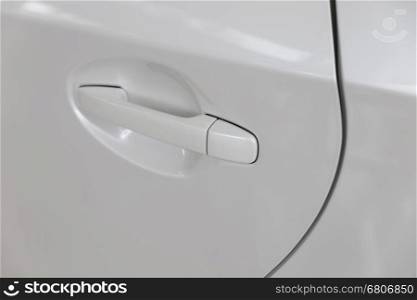 door handle of new white car automobile, selective focus