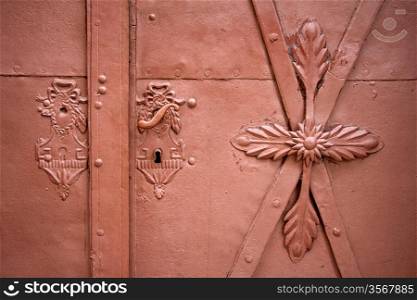 Door handles and locks on old iron brown door