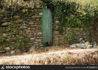 Door in a stone wall, Cinque Terre National Park, La Spezia, Liguria, Italy