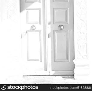 door in antique village santorini greece europe and white wall