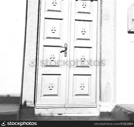 door in antique village santorini greece europe and white wall