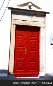 door in antique village santorini greece europe and white wall