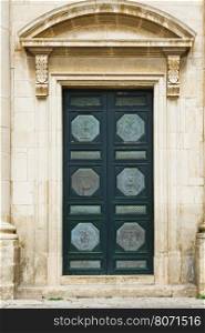 Door of the Church Decorated with Scenes from the Life of Bible in the Sicilian City of Ragusa