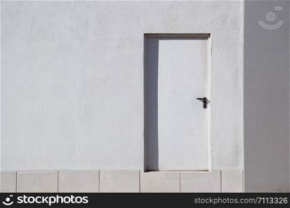 door on the white building facade in the city