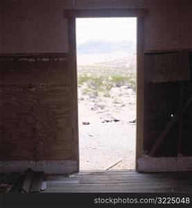 Door Opening Onto A Desert Landscape