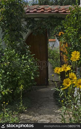 Door with flower for entrance in yard of monastery