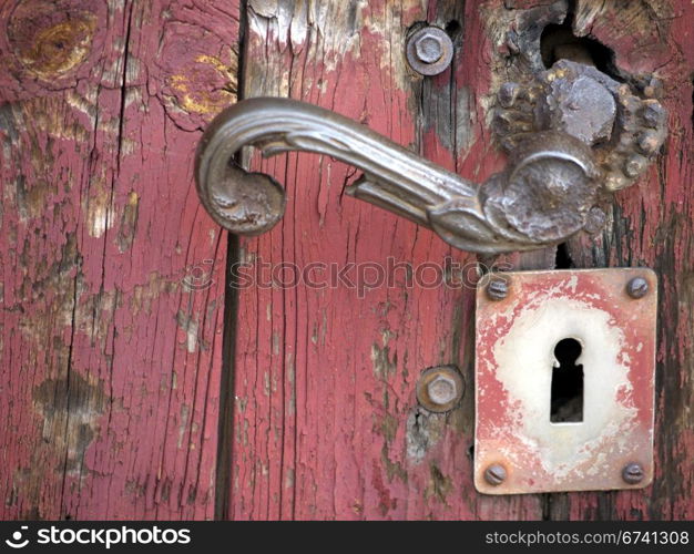 Doorhandle on a formerly red door