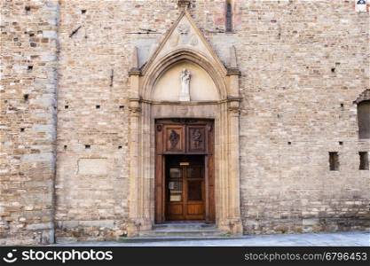 doors of Church Santa Maria Maggiore di Firenze in Florence. This is among the oldest extant churches in city, it was originally constructed in 11th century