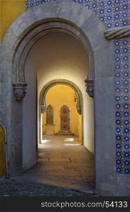 Doorway in the Pena National Palace at Sintra near Lisbon in Portugal. Originally built on the site of the Monastery of Nossa Senhora da Pena, it was renovated extensively by Ferdinand II of Portugal. A UNESCO World Heritage Site.