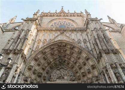 Doorway of Seville cathedral Andalusia Spain view from below.