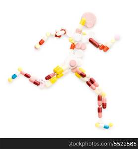 Doping drugs and pills in the shape of an athletic runner on track.
