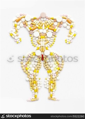 Doping drugs and steroid hormones in the shape of a muscular bodybuilder.