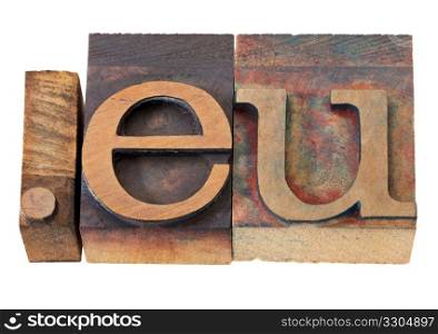 dot eu - internet domain for European Union in vintage wooden letterpress printing blocks, stained by color inks, isolated on white