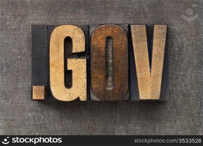 dot gov - internet domain for government in vintage wooden letterpress printing blocks on a grunge metal sheet