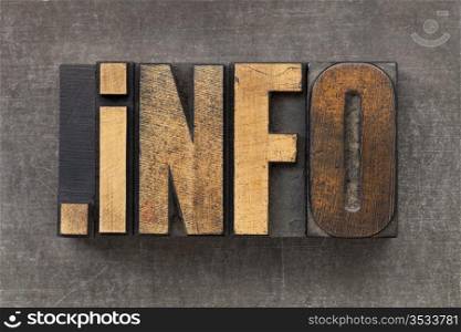 dot info - internet domain for information resources in vintage wooden letterpress printing blocks on a grunge metal sheet