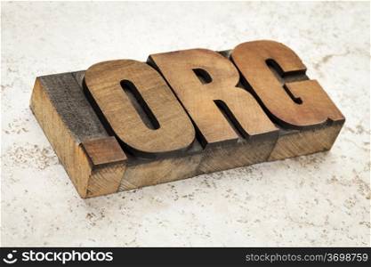 dot org internet domain - network address for nonprofit organization in vintage letterpress wood type on ceramic tile background