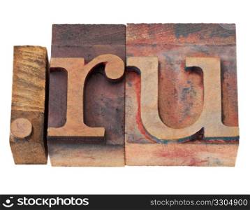 dot ru - internet domain for Russia in vintage wooden letterpress printing blocks, stained by color inks, isolated on white