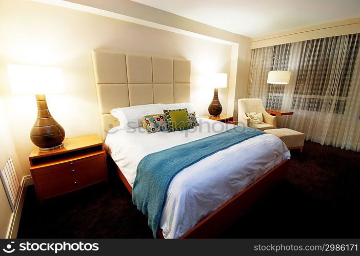 Double bed in the modern interior room