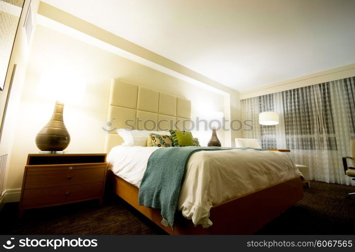 Double bed in the modern interior room