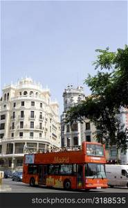Double decker bus on a road in a city, Madrid, Spain