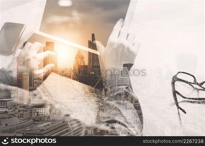 Double exposure,Businessman hand working concept. Photo professional investor working with new startup project.Digital tablet dock screen computer design smart phone using  
