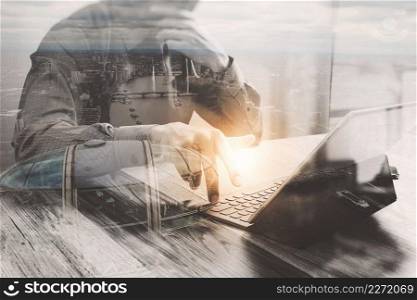Double Exposure,businessman working with new start up project.using smart phone digital tablet docking smart keyboard on wooden desk,sun effect