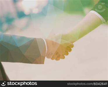 Double exposure design. Business partners concept with businessman and businesswoman handshake at modern office indoors