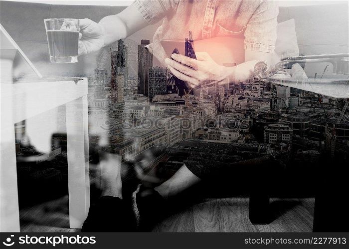 double exposure,hipster hand using smart phone,digital tablet docking keyboard,coffee cup, payments online business,sitting on sofa in living room,work at home concept,London architecture city