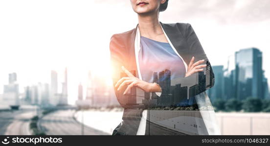 Double Exposure Image of Business Person on modern city background. Future business and communication technology concept. Surreal futuristic cityscape and abstract multiple exposure graphic interface.