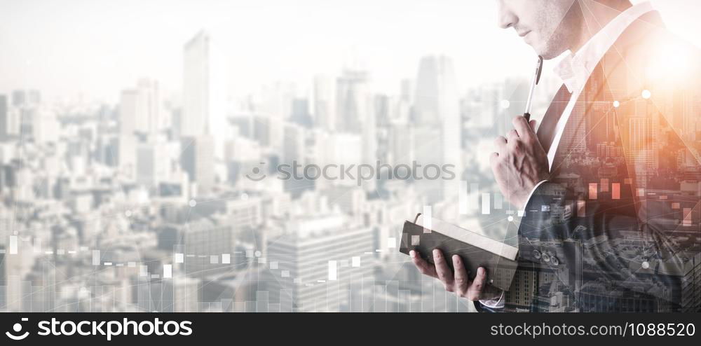 Double Exposure Image of Business Person on modern city background. Future business and communication technology concept. Surreal futuristic cityscape and abstract multiple exposure graphic interface.