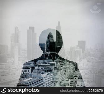 double exposure of back view of success businessman looking at london building as concept