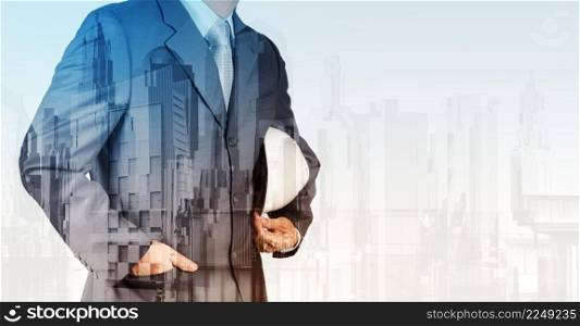 Double exposure of business engineer and abstract city as concept