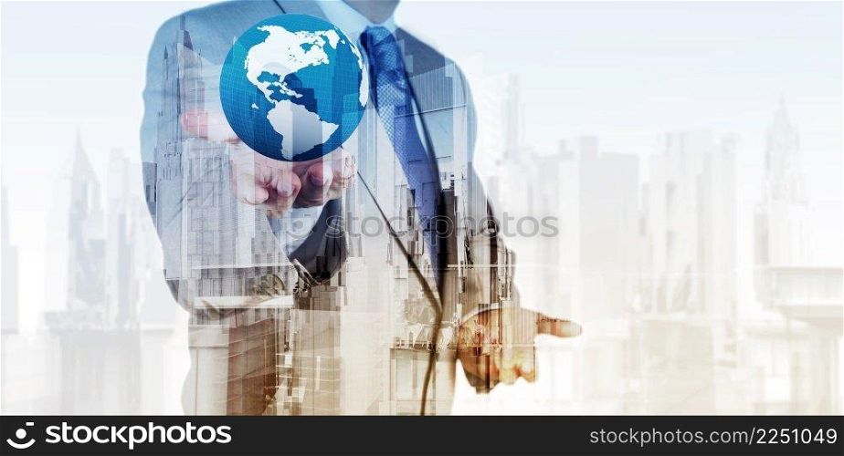 Double exposure of business engineer holding the earth and abstract city as concept 