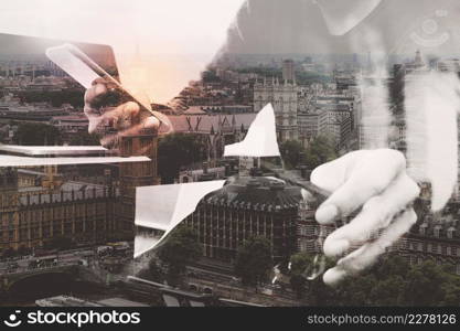 double exposure of business man hand using smart phone and laptop computer for online banking payment or application development,London architecture city