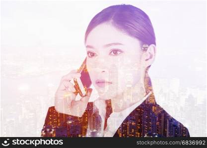 double exposure of business woman talking on smartphone with a city background