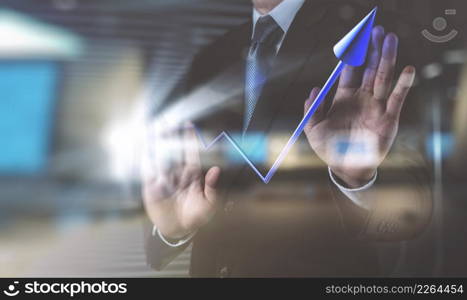 double exposure of businessman hand draws business success chart concept on virtual screen