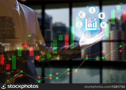 Double exposure of Businessman hand holding interface of Fintech with cityscape and stock market or financial graph for financial investment concept.