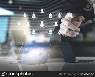 Double exposure of businessman hand points human resources, CRM and social media as concept