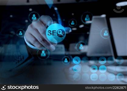 double exposure of businessman hand showing search engine optimization SEO as concept
