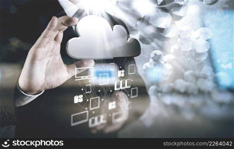 double exposure of Businessman hand working with a Cloud Computing diagram on the new computer interface as concept