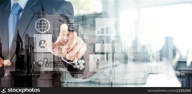 Double exposure of  businessman hand working with new modern computer and business strategy as concept