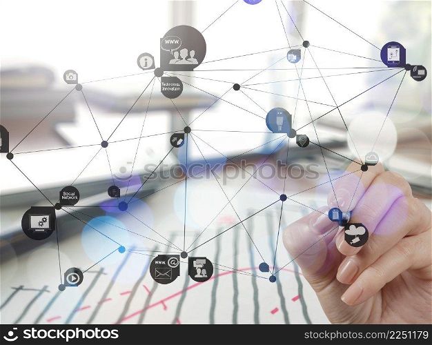 Double exposure of businessman hand working with new modern computer show social network structure as concept