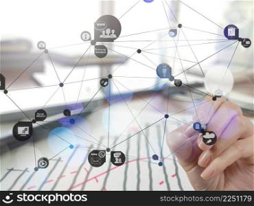 Double exposure of businessman hand working with new modern computer show social network structure as concept