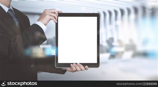double exposure of businessman success working with blank tablet computer his board room background