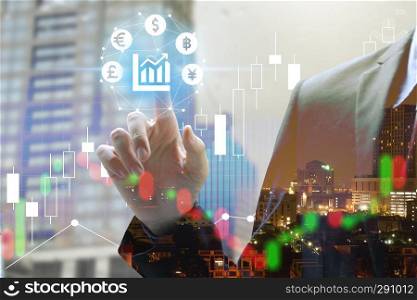 Double exposure of businessman touch virtual currency with cityscape and stock market or financial graph for financial investment concept.