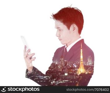 Double exposure of businessman using the tablet against the city isolated on white background