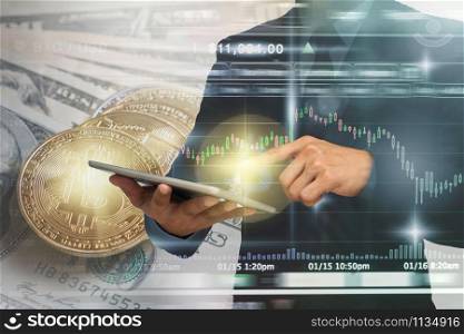 Double exposure of businessman using the tablet with Bitcoin exchange of trading screen on Closeup Bitcoins mockup on the money paper bank of various country, cryptocurrency and investment concept