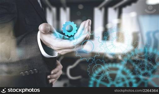 double exposure of businessman working with blue light gear to success as concept