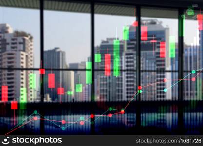 Double exposure of cityscape and stock market or financial graph for financial investment concept.
